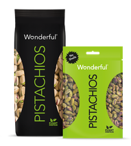 Black package of Wonderful Pistachios with shells and green package of Wonderful Pistachios with no shells